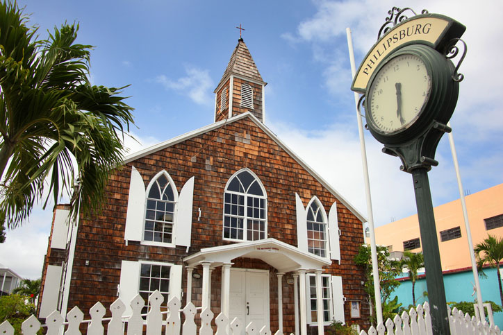The Methodist Church with a traditional street clock outside, Philipsburg, St Maarten, Caribbean.