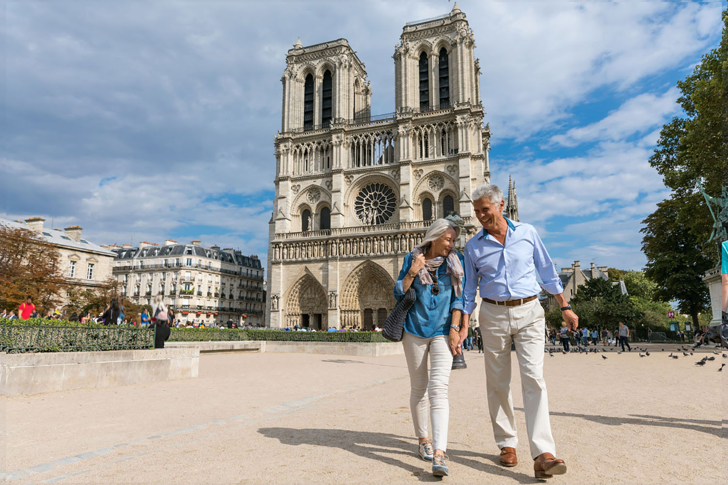 A couple walks through the streets of Paris