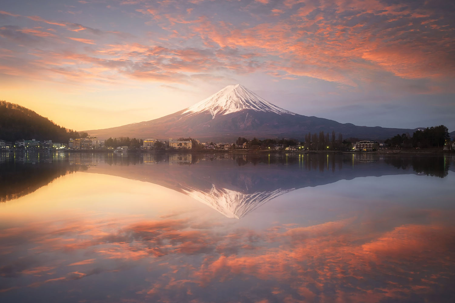 Fuji mountain reflection on water at sunrise near kawaguchiko lake, Japan