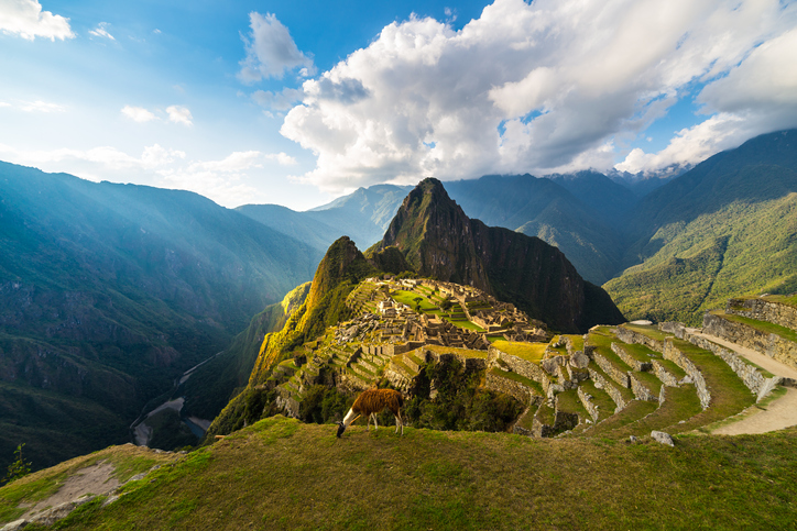 Machu Picchu illuminated by the warm sunset light