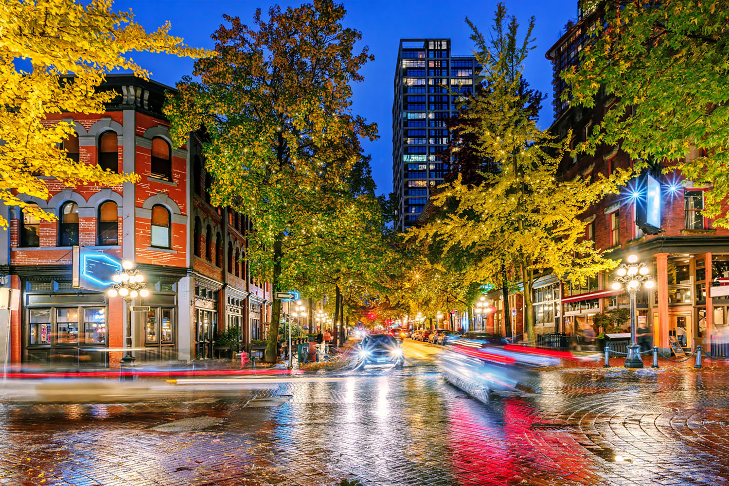 A wet city street after an evening rain