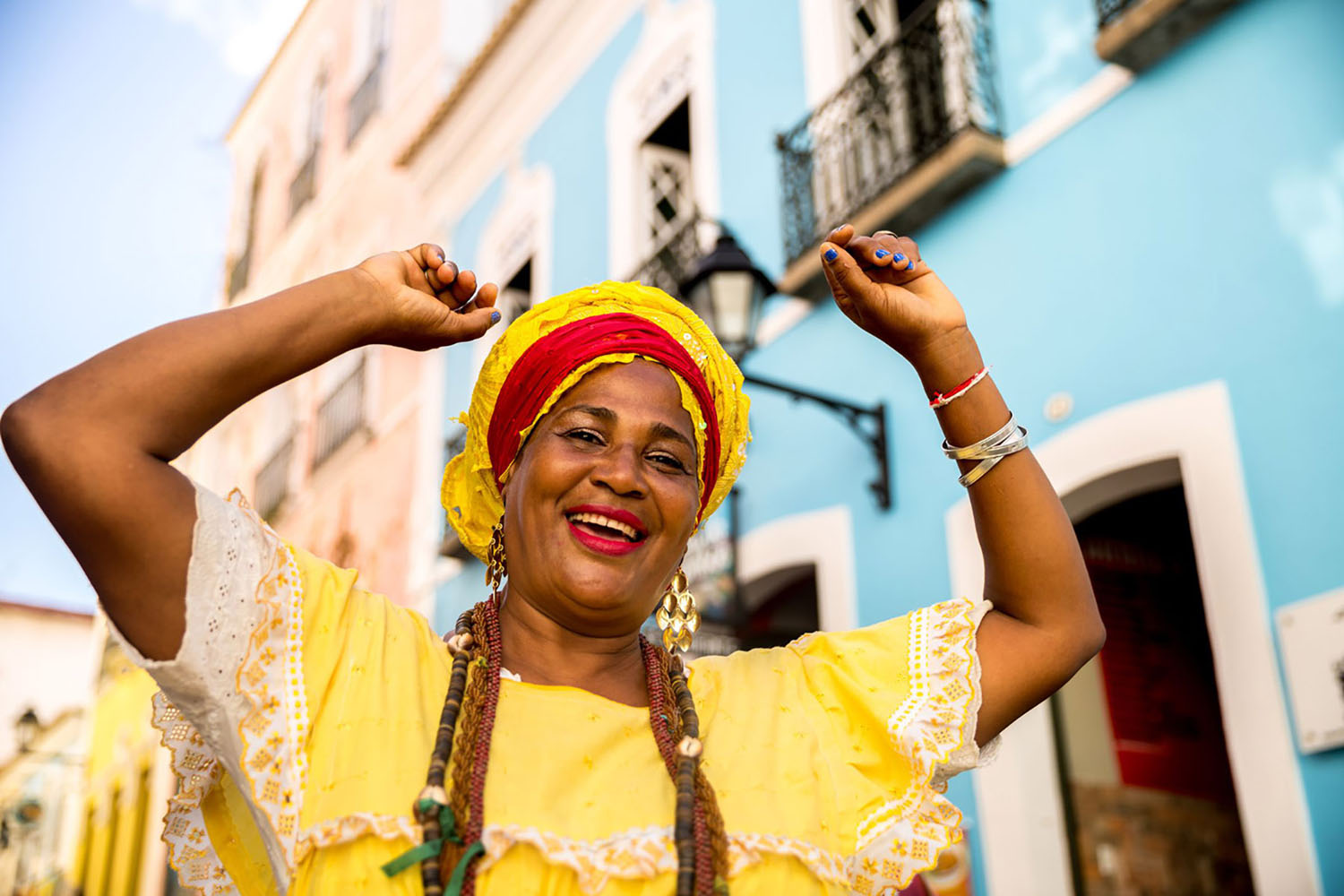 Beautiful woman dancing in colorful outfit
