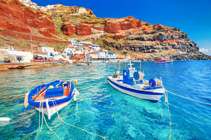 Boats in the water near Oia, Santorini, Greece