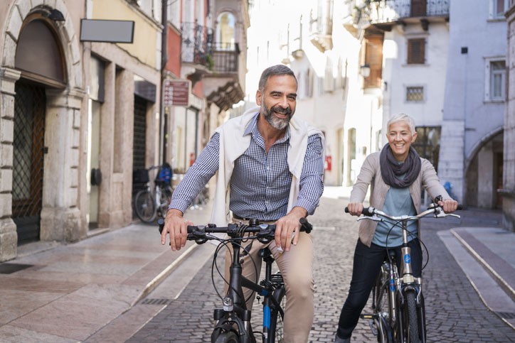 A couple exploring a city on bicycle