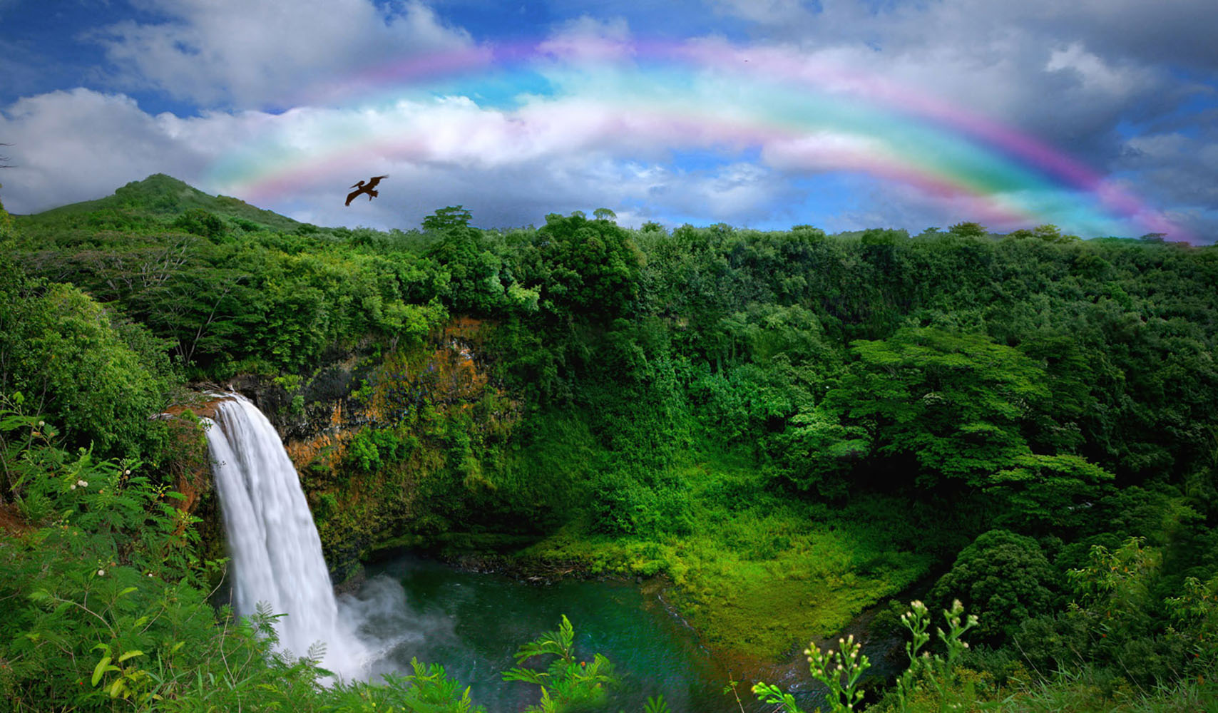 Waterfall With Rainbow in Kauai, Hawaii
