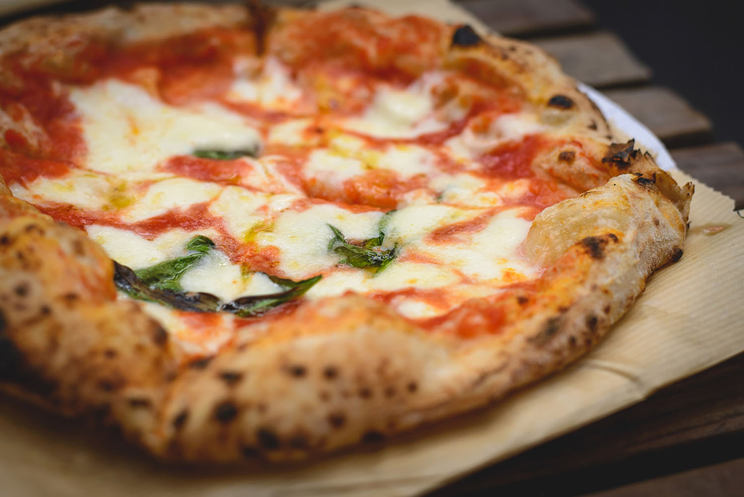 Margherita Neapolitan style pizza with buffalo mozzarella, tomato sauce and basil