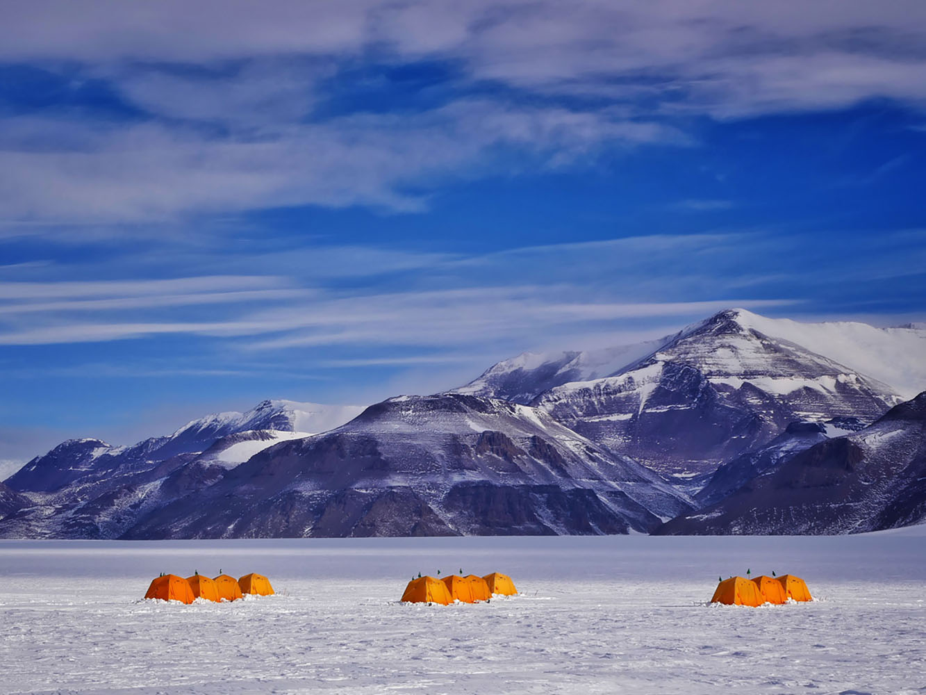 Orange tents that house scientists in Antarctica.