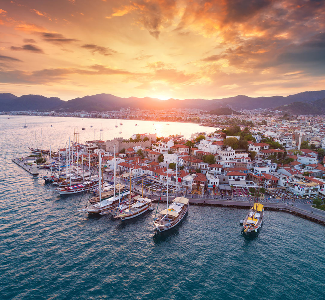 Aerial view of boats and yachts and architecture at sunset in Marmaris, Turkey. 