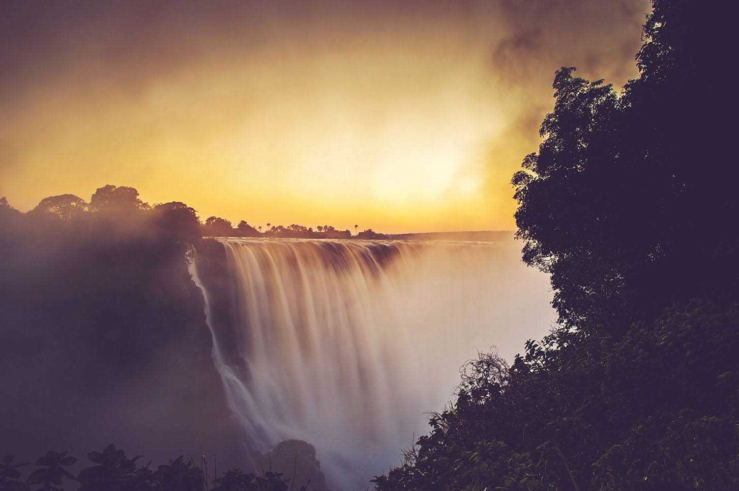 The Victoria Falls in flood at sunrise