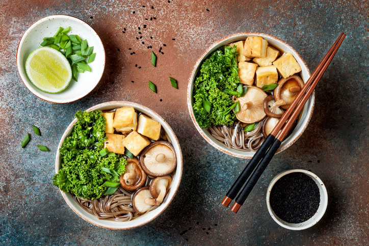 Miso and soba noodles soup with kale, shiitake mushrooms, roasted tofu
