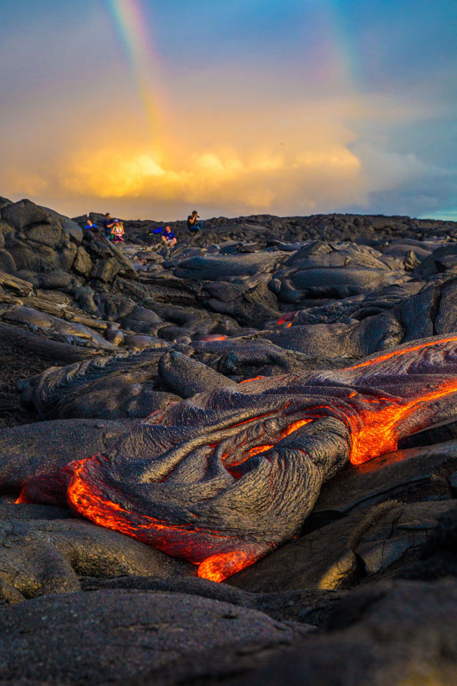 Travelers explore the rock formations in Hawaii Volcanoes National Park