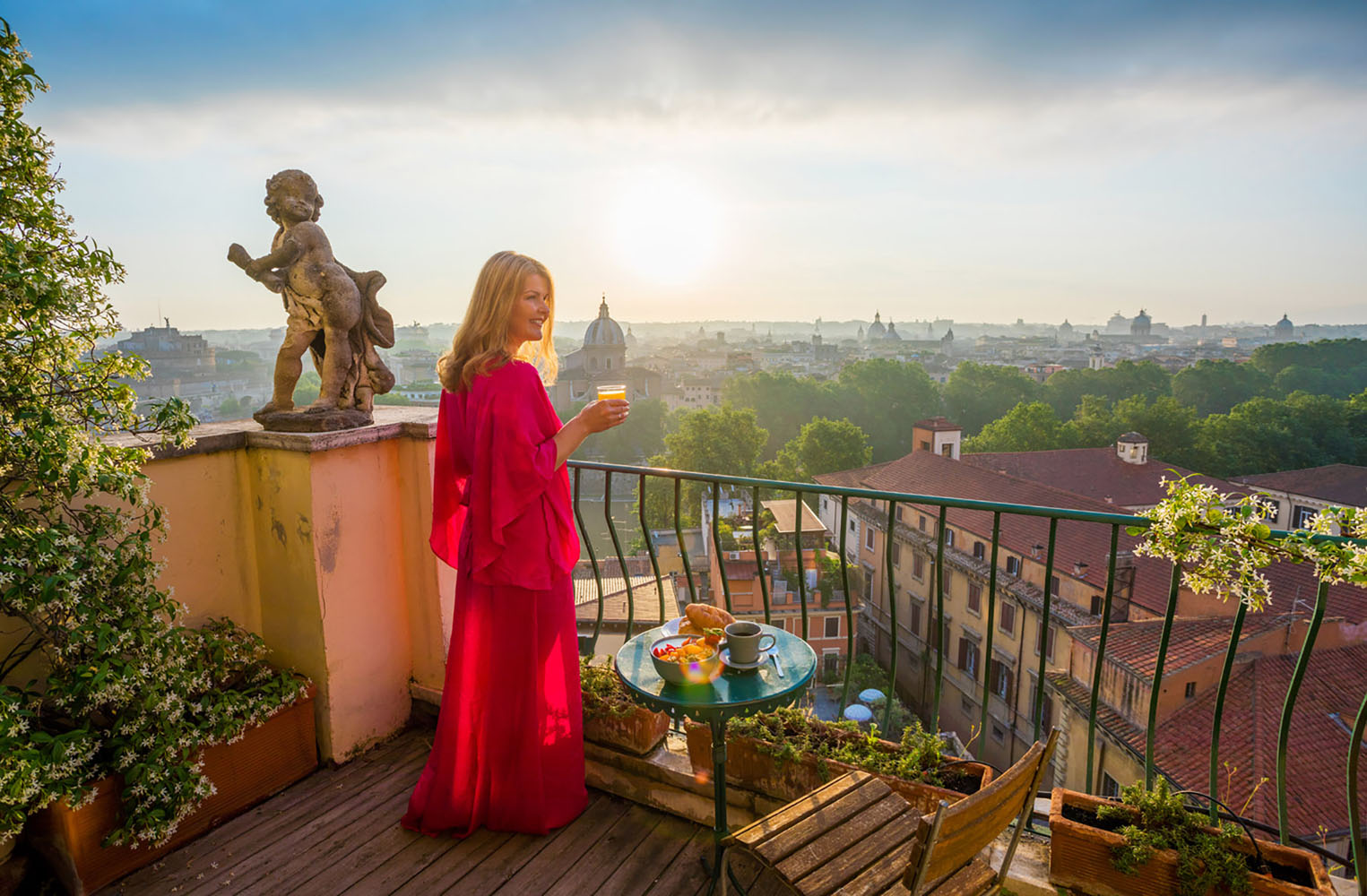 Woman standing on balcony overlooking Rome