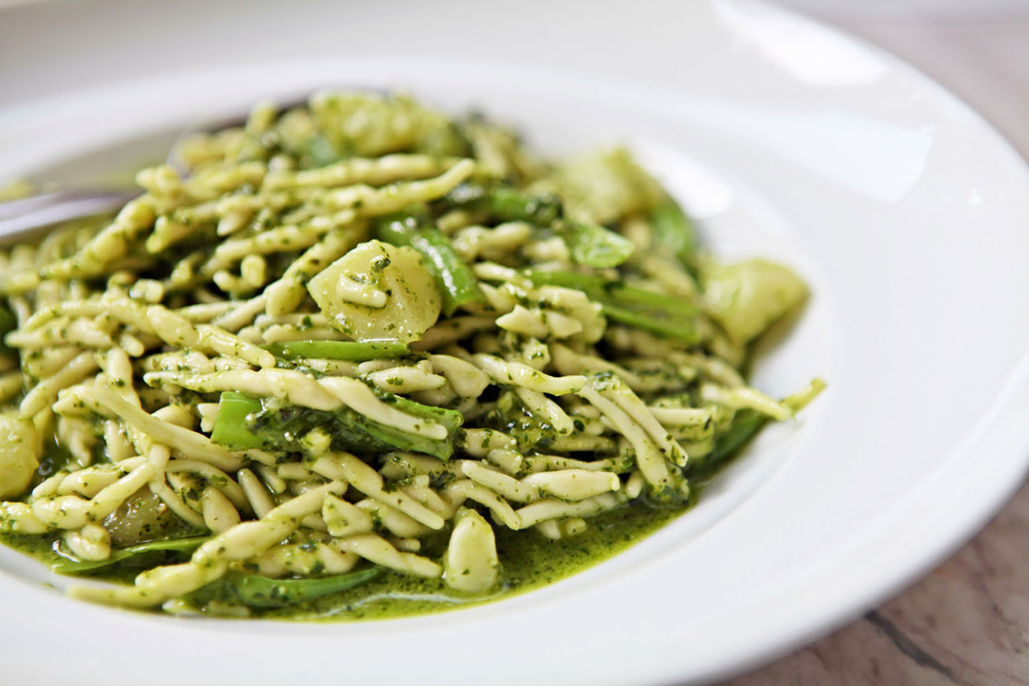 Basil pesto is served with Trofie pasta in Cinque Terre.