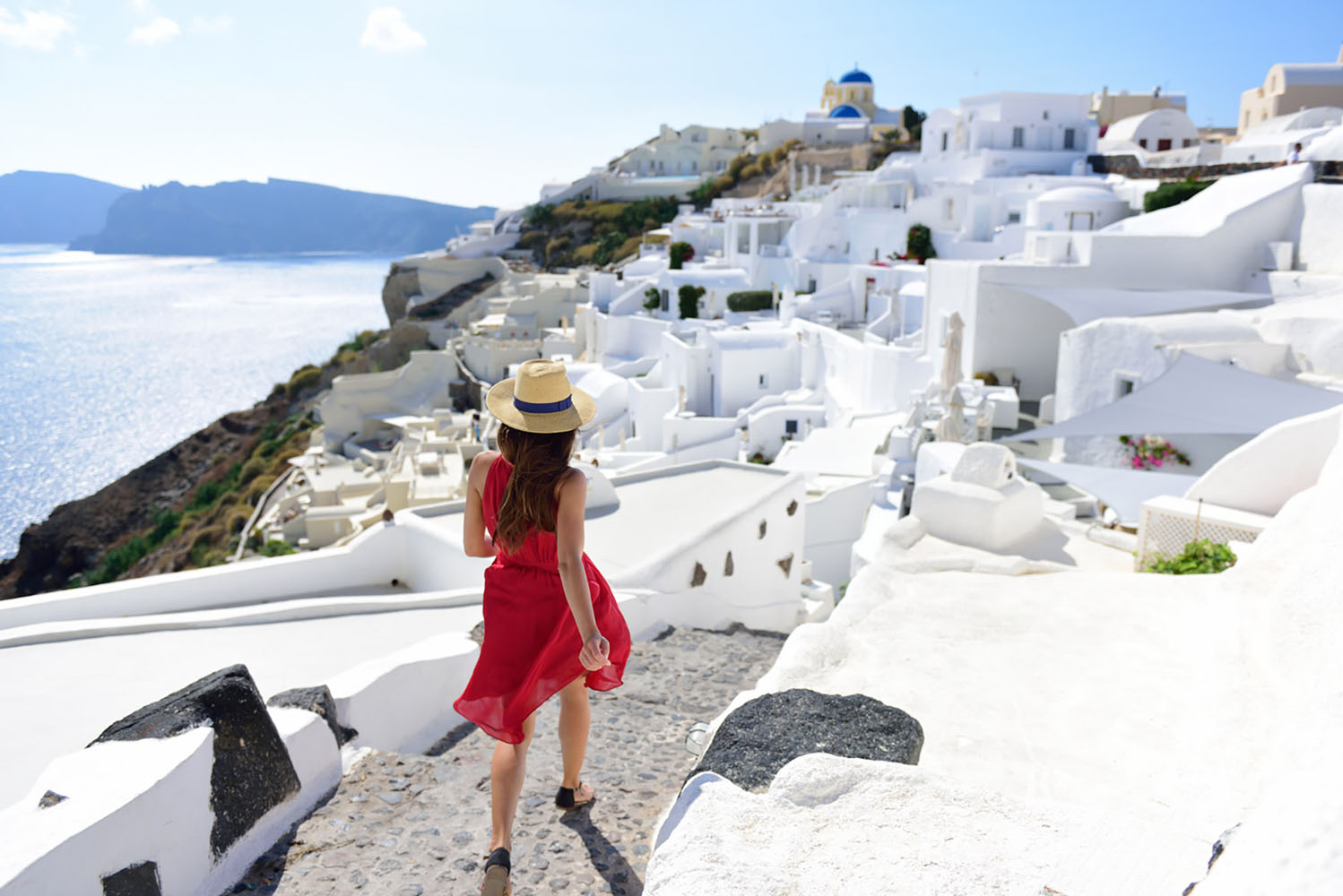 Walking is a great way to explore a travel destination, like beautiful Santorini.