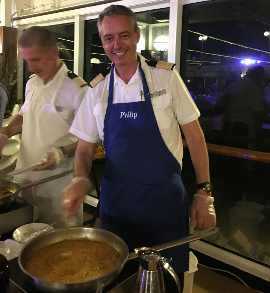 The cruise ship crew making Crepes Suzette during Azamara's White Night party.
