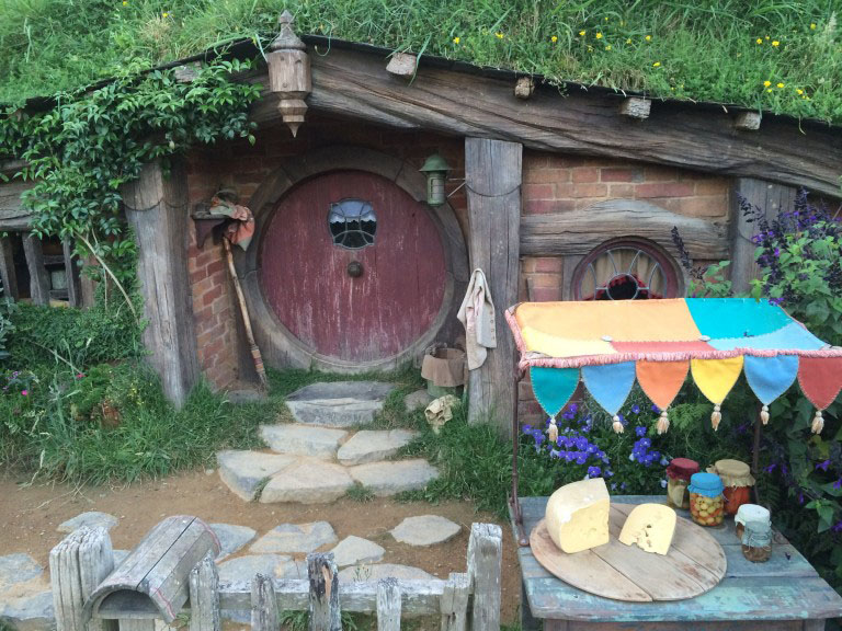 A hobbit house with a purple door from the hobbiton movie set