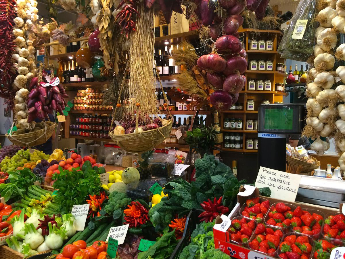 Baskets of fruits and vegetables in the San Lorenzo market in Florence, Italy
