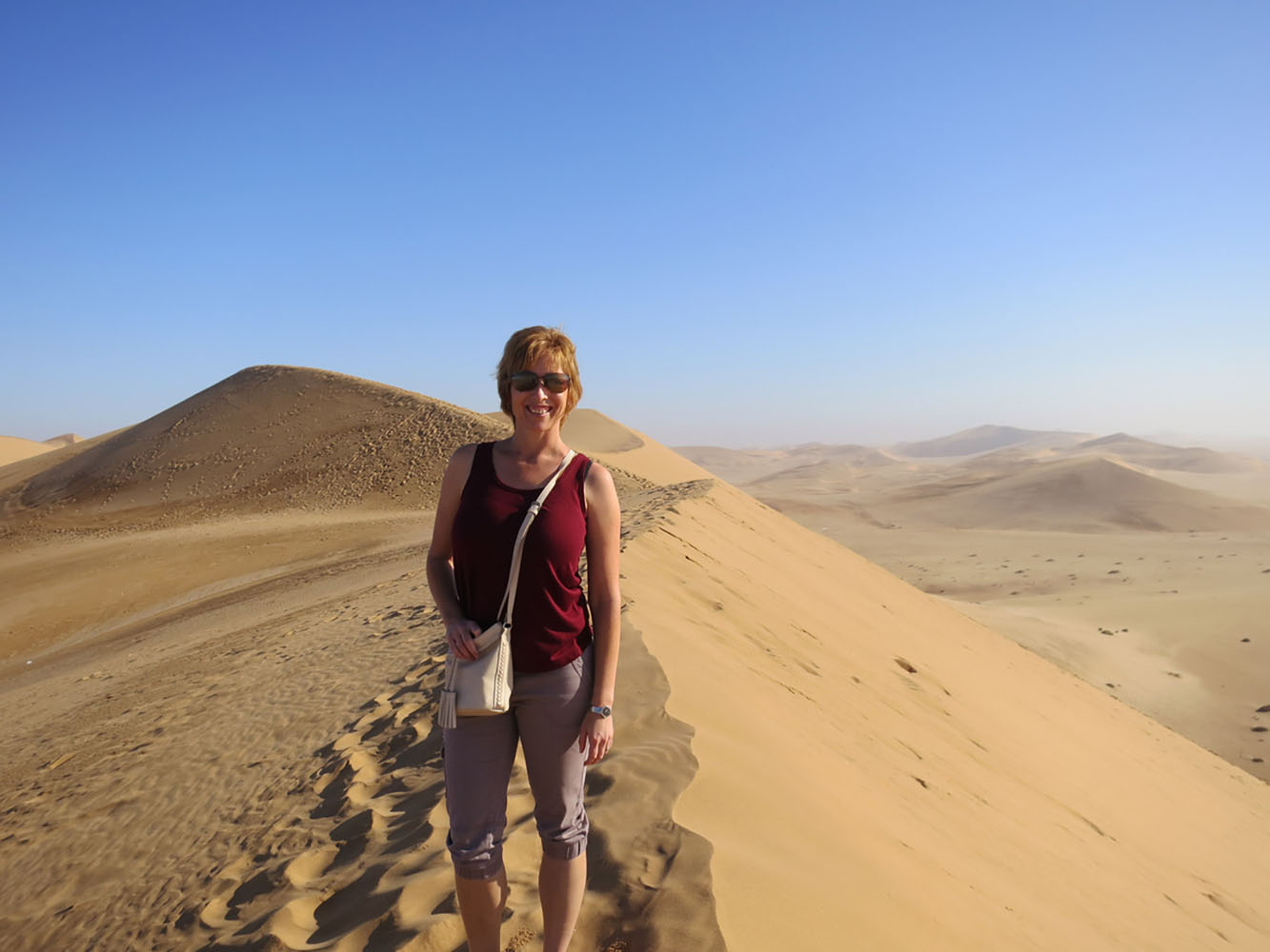 Liesl standing in the desert in Namibia.