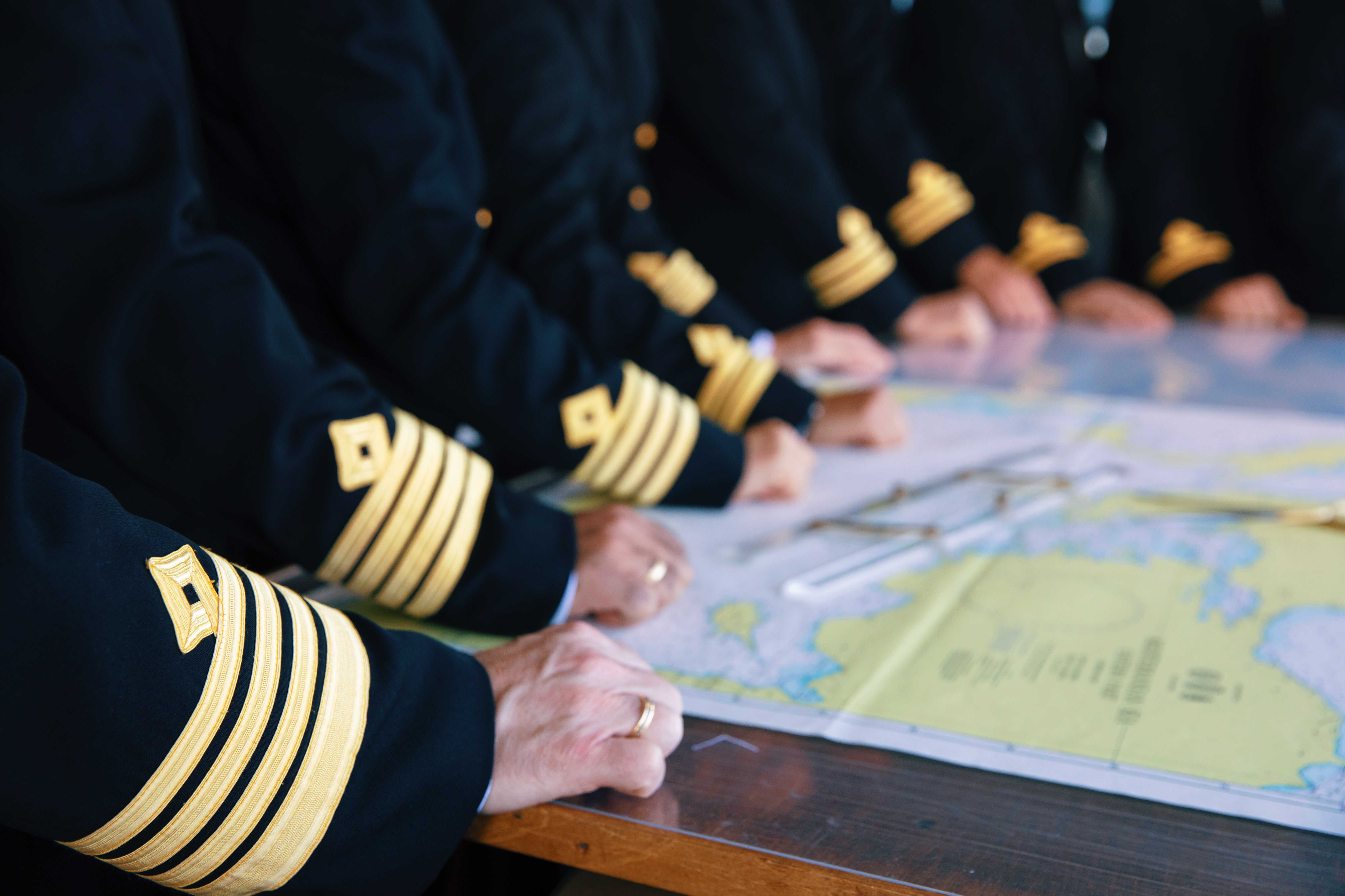 Azamara employees looking at a map
