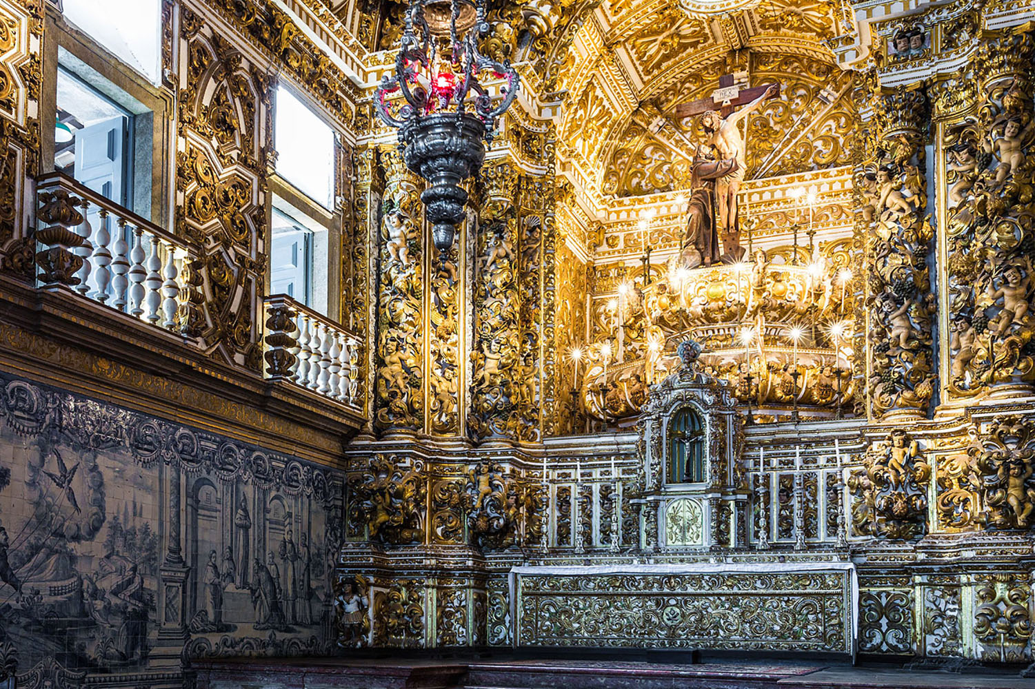 Azulejo tiles on the wall and ornate gold in the São Francisco Church and Convent in Salvador De Bahia