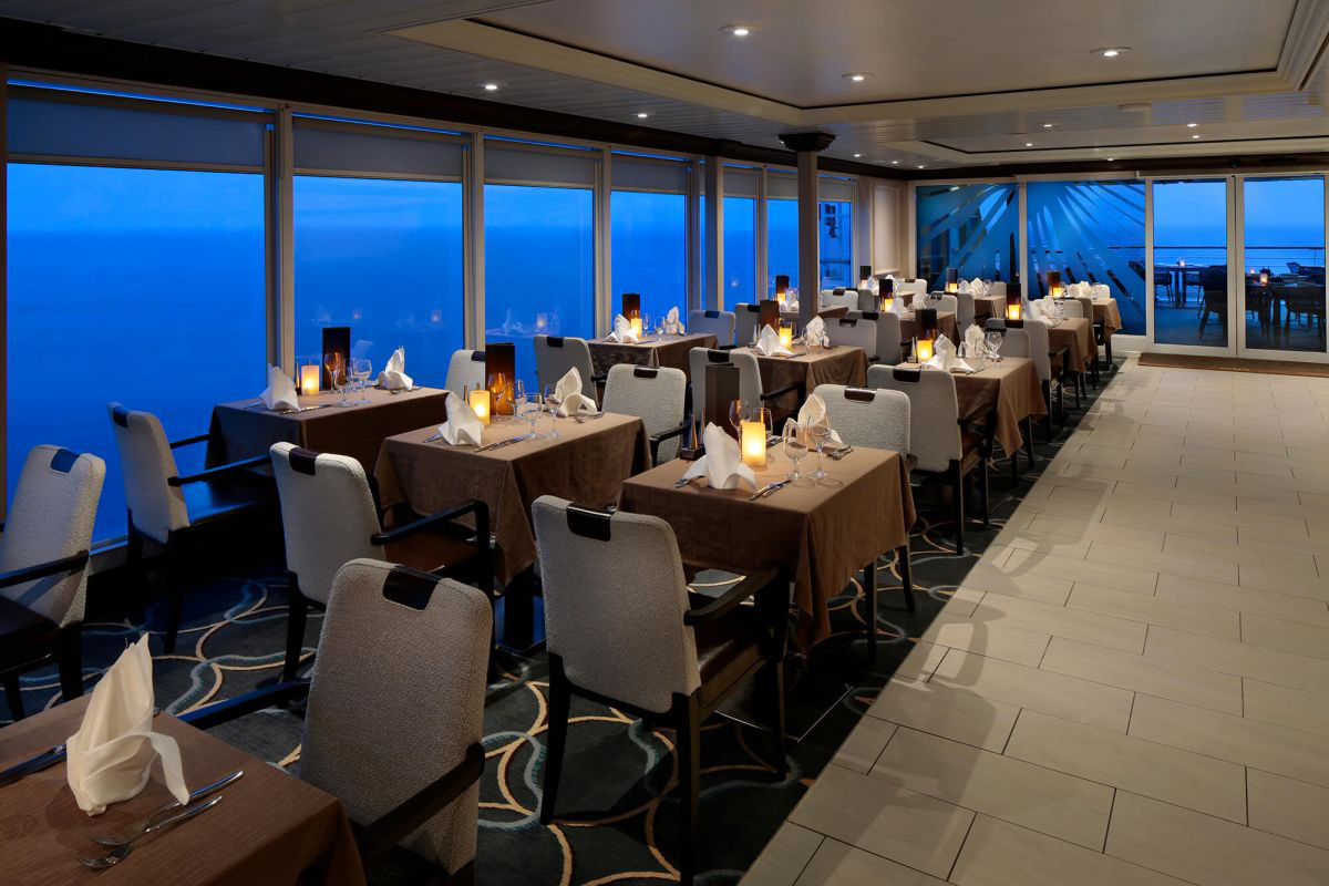Tables set for dinner at the Windows Cafe on Deck 9