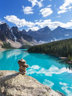 crystal blue water in valley at the foot of mountain range