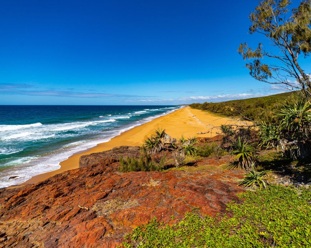 Golden beach and blue sea near Gladstone, a new Azamara cruise port in Queensland