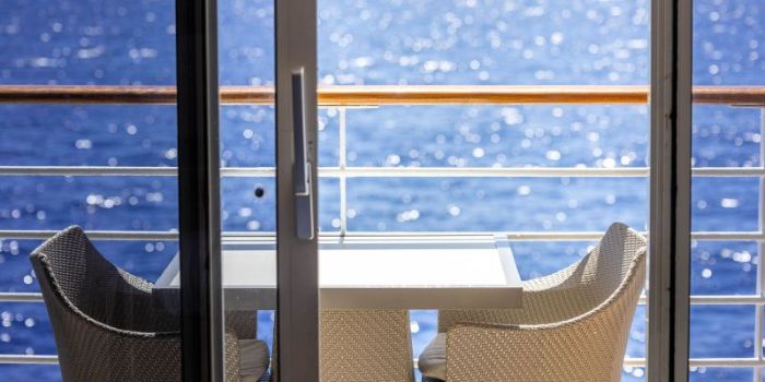 ships captain taking a selfie from stage with large audience in background