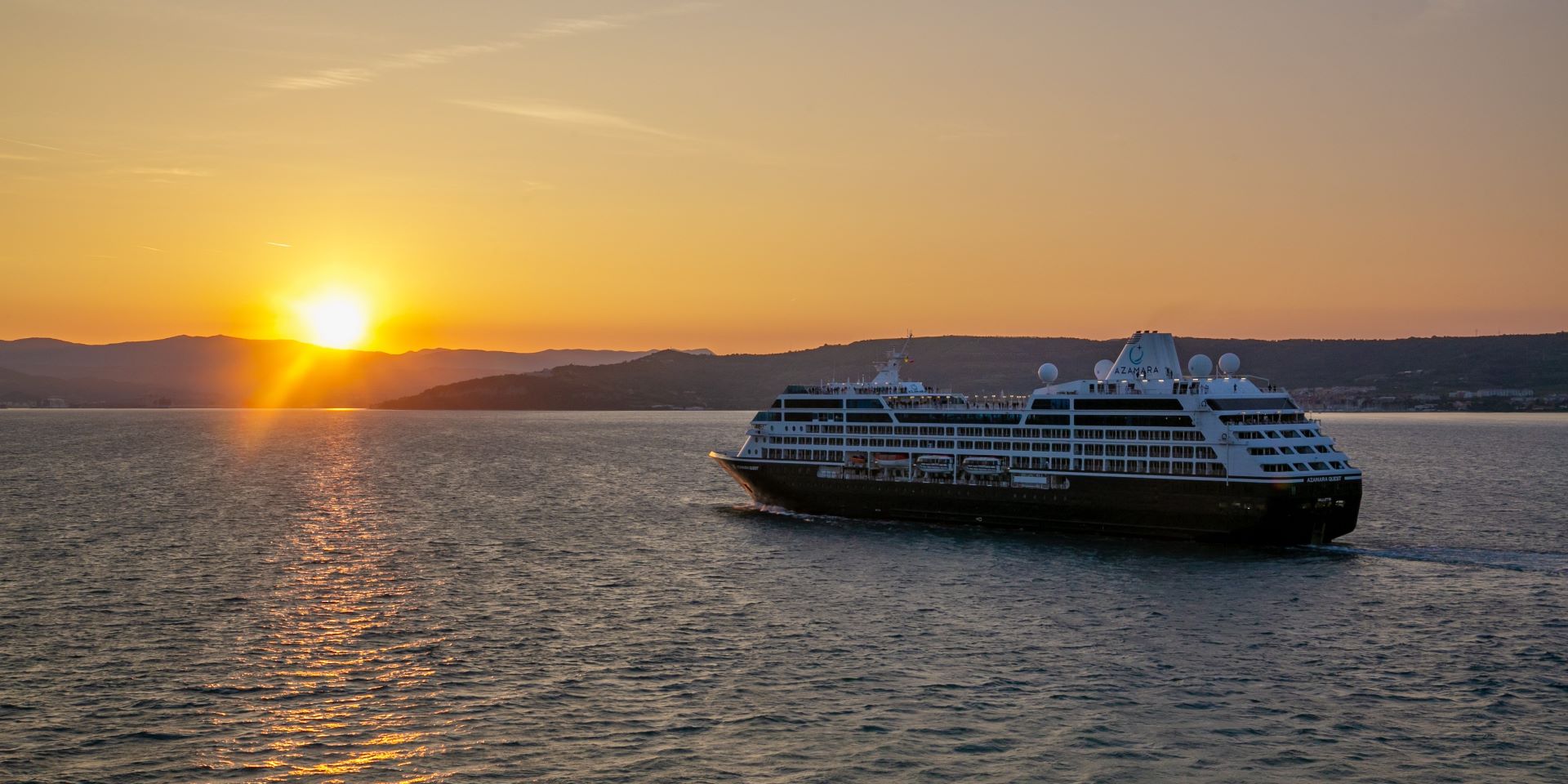 cruise ship sailing from port with beautiful sunset view!'carousel'