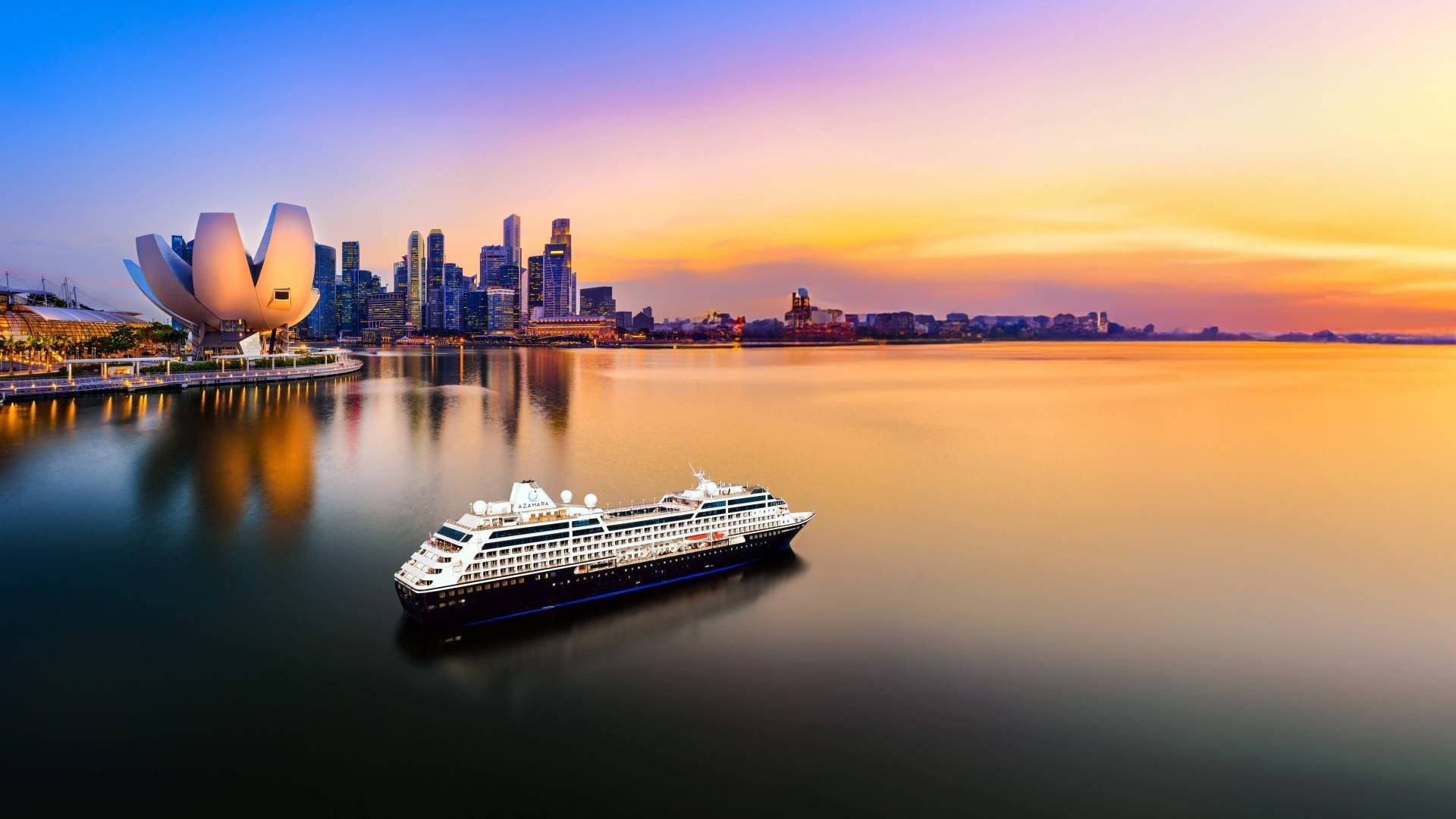 cruise ship in leaving harbor at dusk