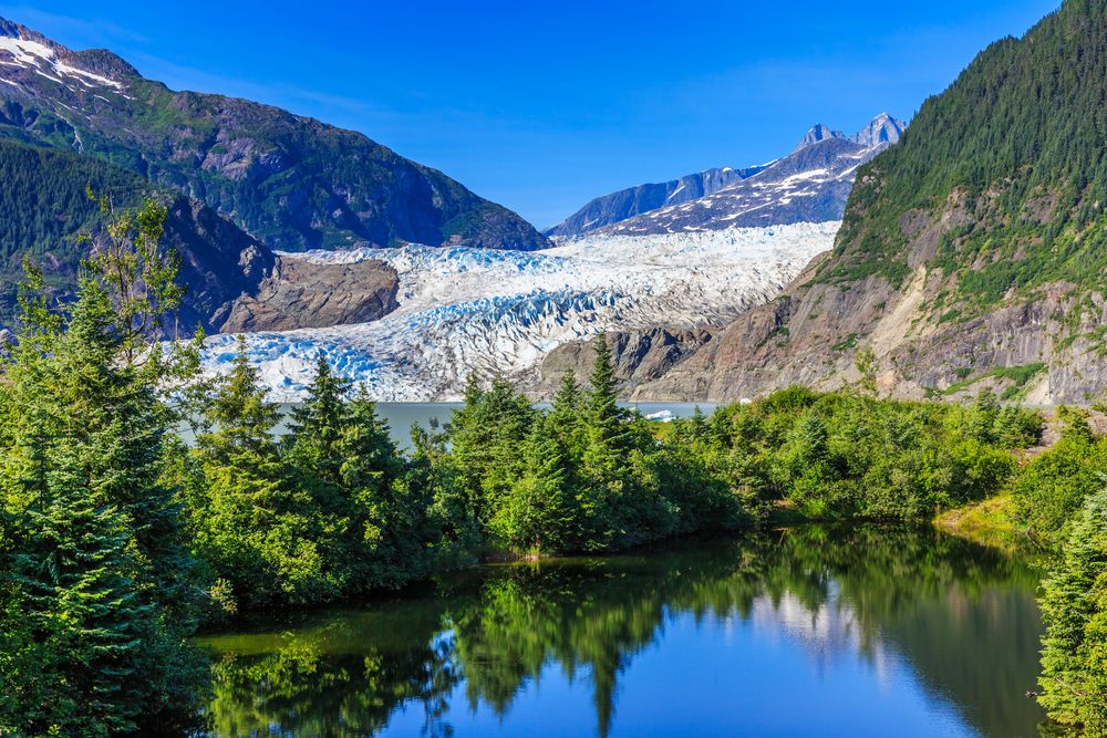 Mendenhall Glacier and lush forest landscape near Juneau, Alaska.
